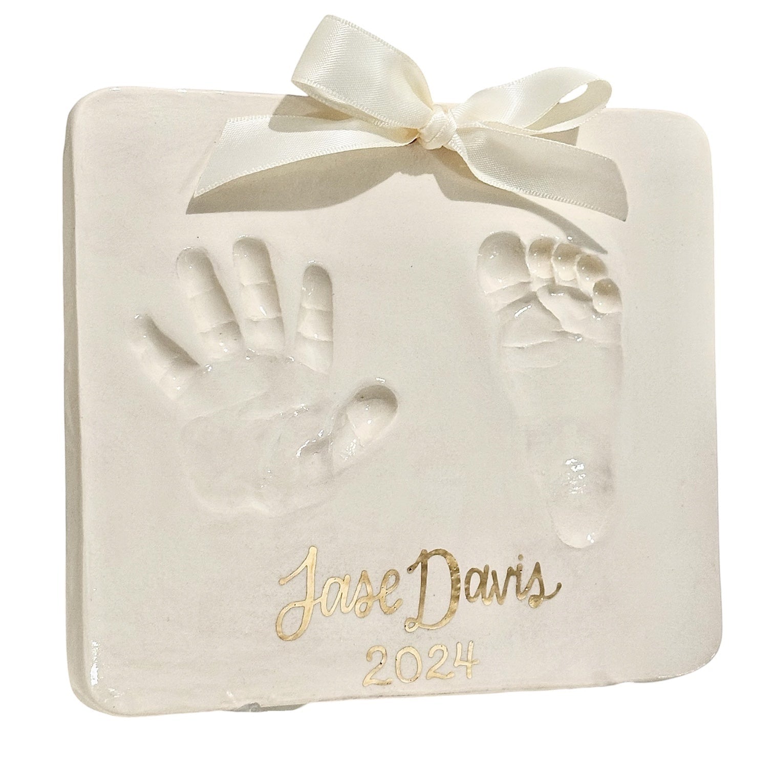 Weeks Studio custom off-white baby handprint and footprint plaque with gold name and year and cream ribbon bow
