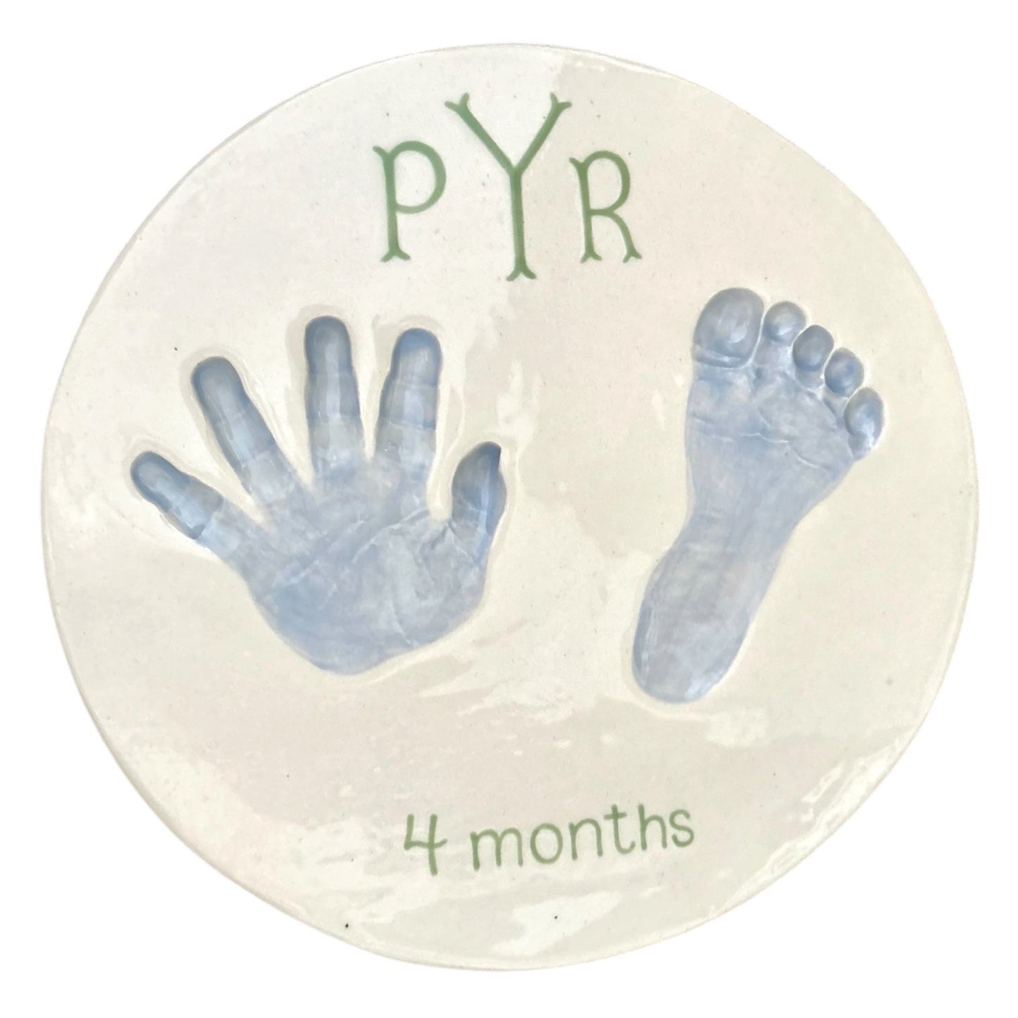 Weeks Studio custom ceramic keepsake plaque featuring a baby handprint and footprint with green text on white glaze.